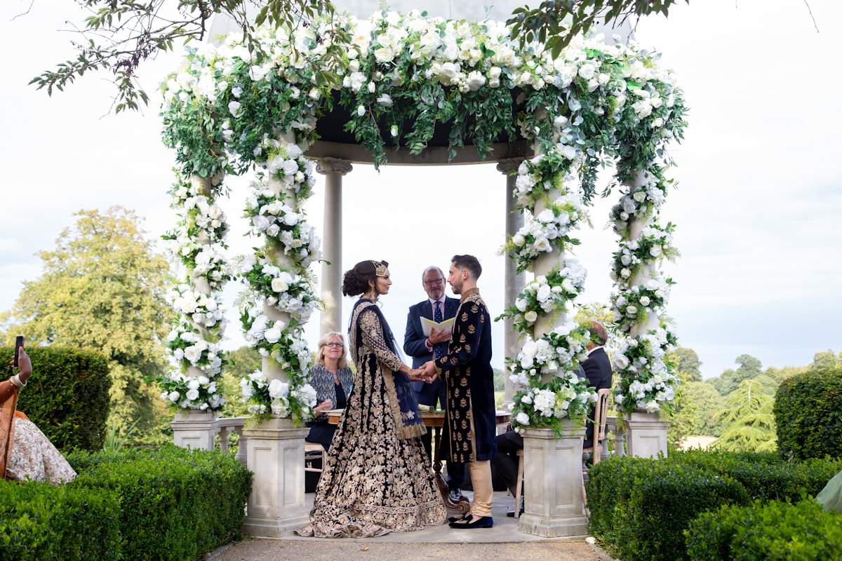 Romantic civil ceremony at Froyle Park's outddor dome. Although the Bride & Groom are having a civil ceremony, they also had a Hindu cultural ceremony at the Venue on the same day, so they are dressed in cultural Asian outfits.
