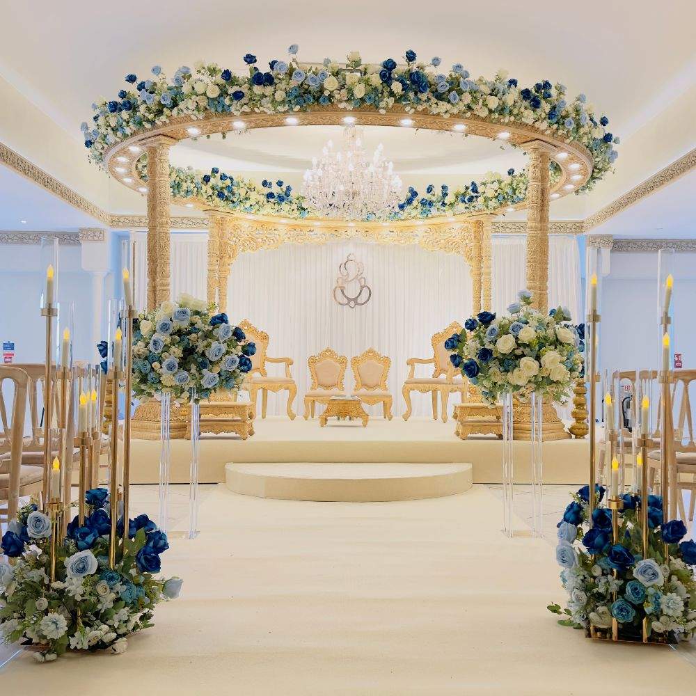 A blue and gold Mandap setup for a Hindu wedding ceremony at Froyle Park, a leading Asian dry hire wedding venue