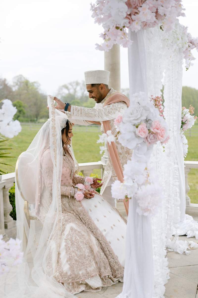 An outdoor Muslim wedding ceremony, known as a Nikkah, at Froyle Park - the premier South Asian Wedding Venue in the UK