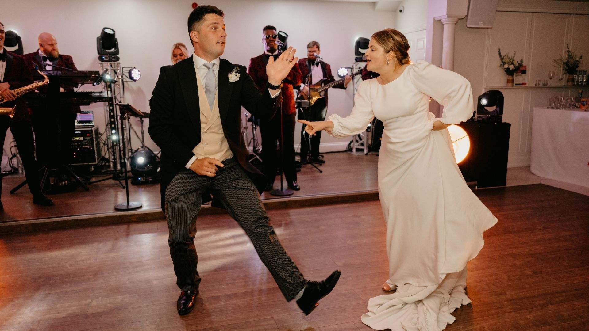 A bride & groom hit the dancefloor with live band at Froyle Park